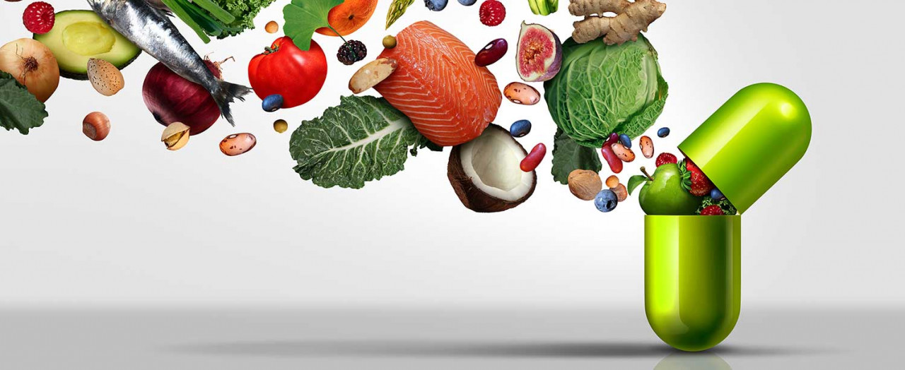 Grafische Darstellung verschiedener Gemüsesorten, die in eine grüne Kapsel hineinfliegen